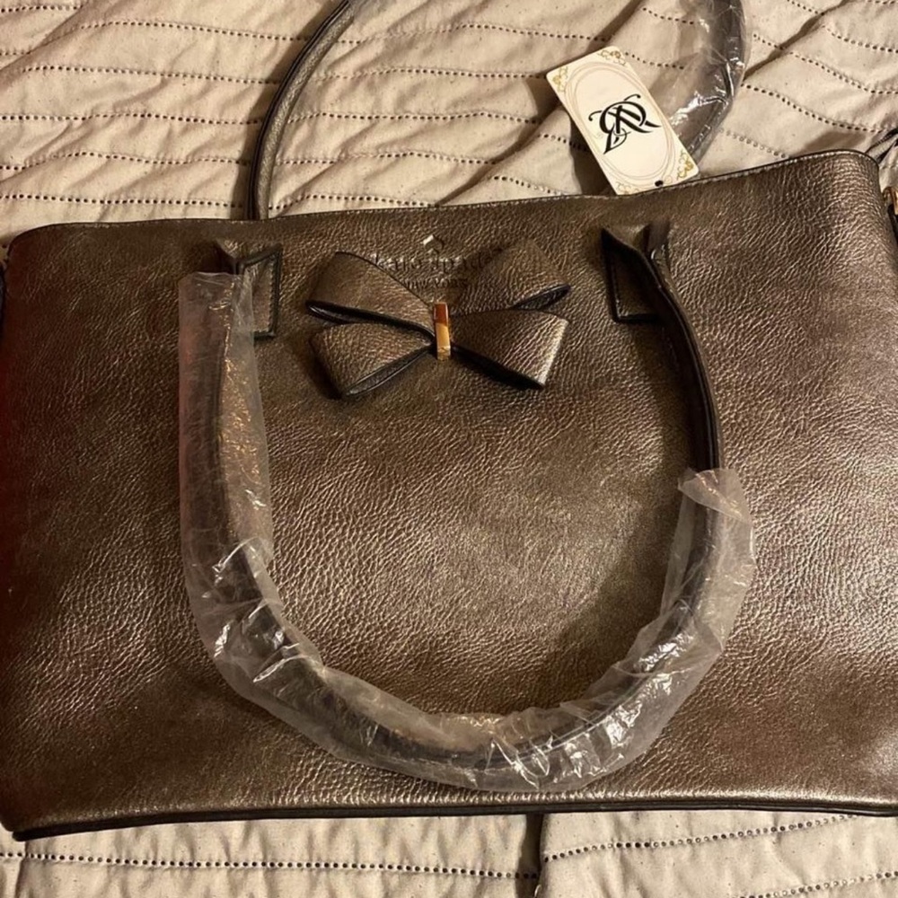 Kate Spade purse, new with tags! Still in plastic